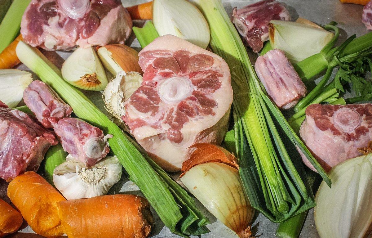 Roast the bones and vegetables before adding them to the stock pot.