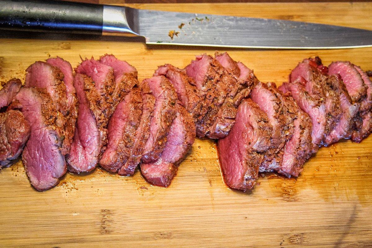 Grill the backstrap to your desired doneness and slice thinly.