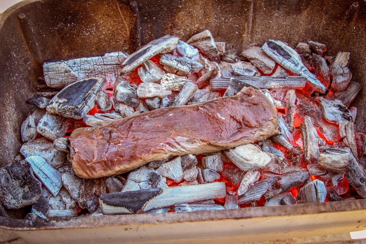 It only takes a couple minutes per side to cook the meat on the glowing hot coals.