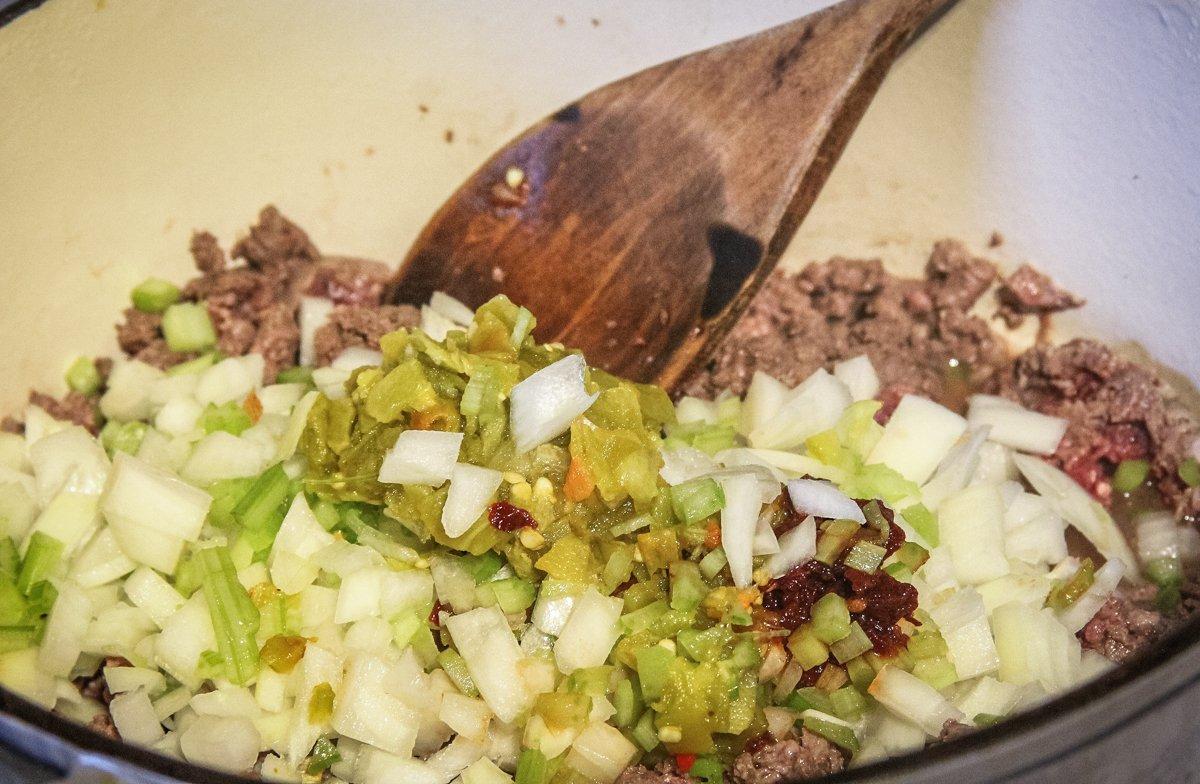 Brown the ground venison with the vegetables.