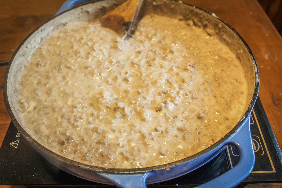 Return the browned venison to the pan and blend it into the gravy.