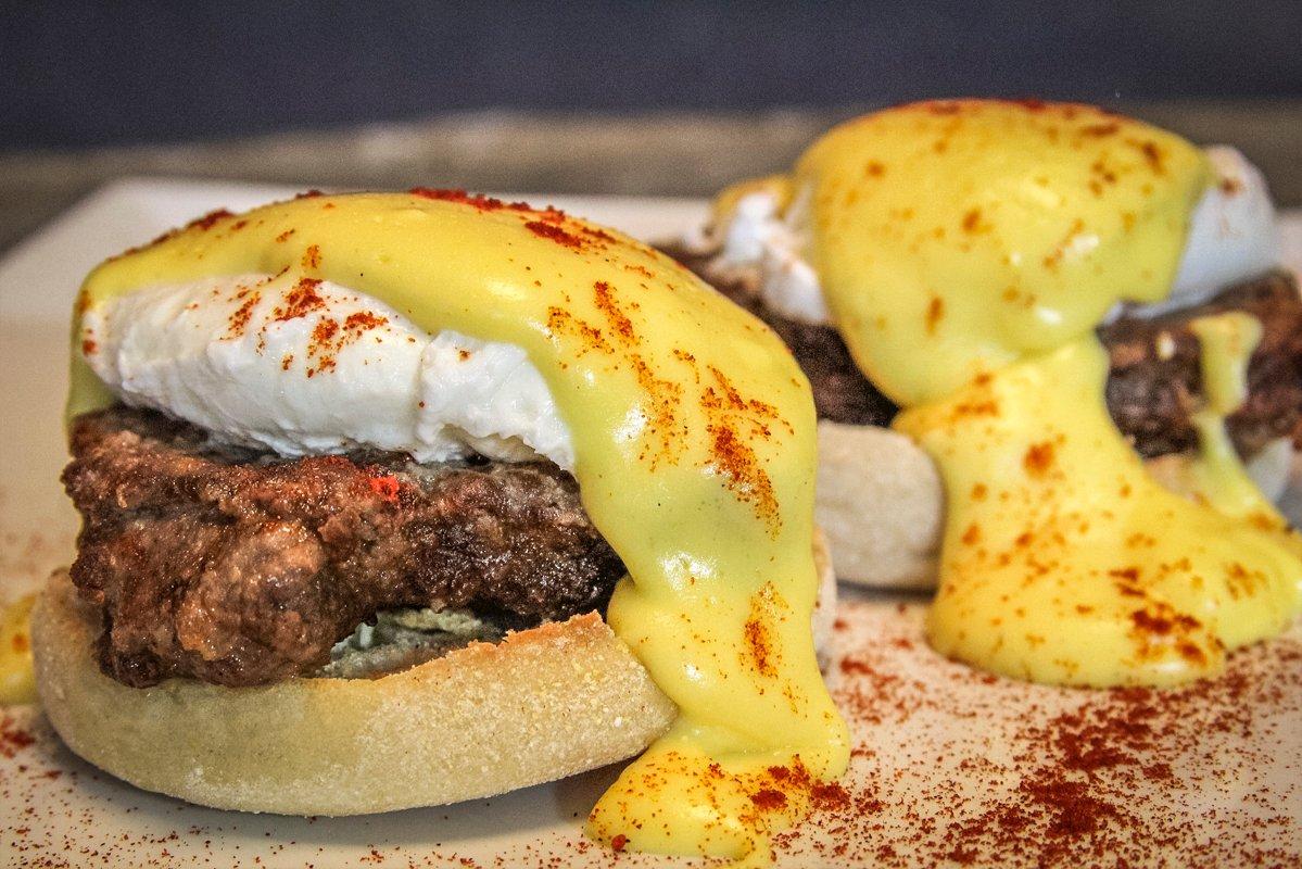 Top the poached egg and backstrap with hollandaise sauce and a sprinkle of smoked paprika.