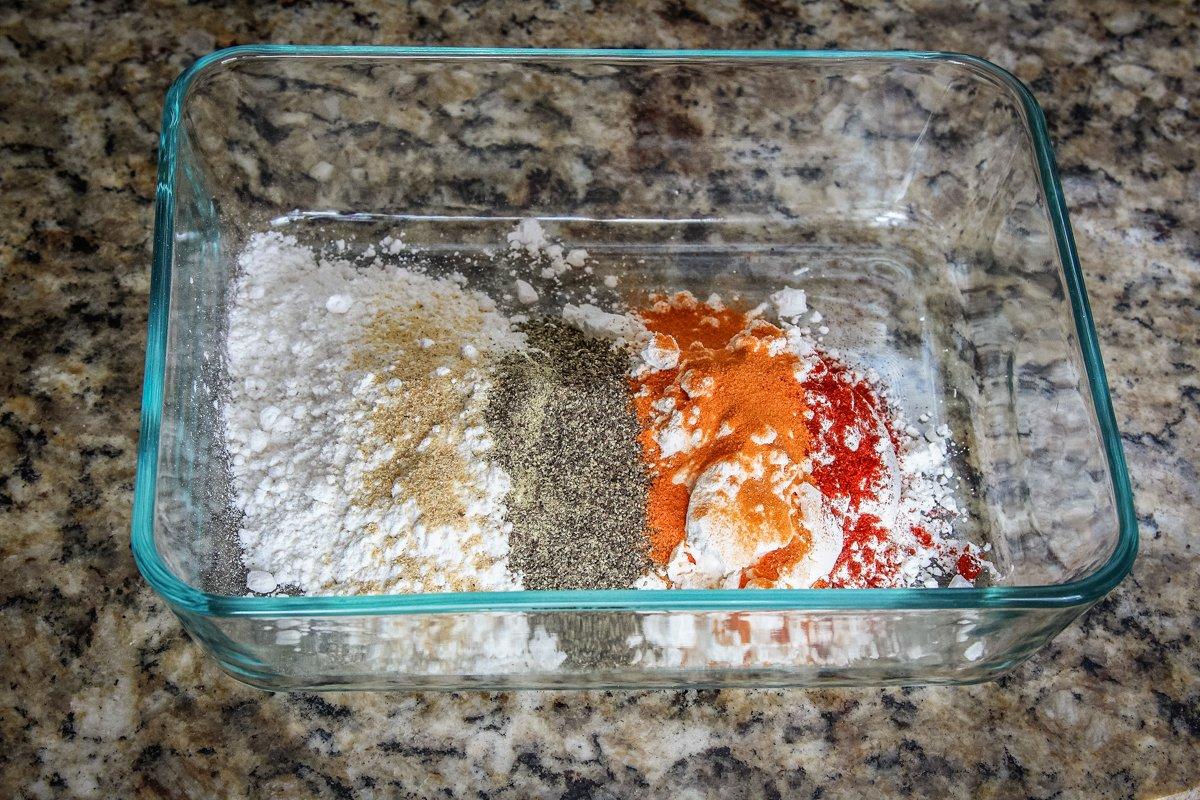 Mix the corn starch, flour, and seasonings in a shallow dish.