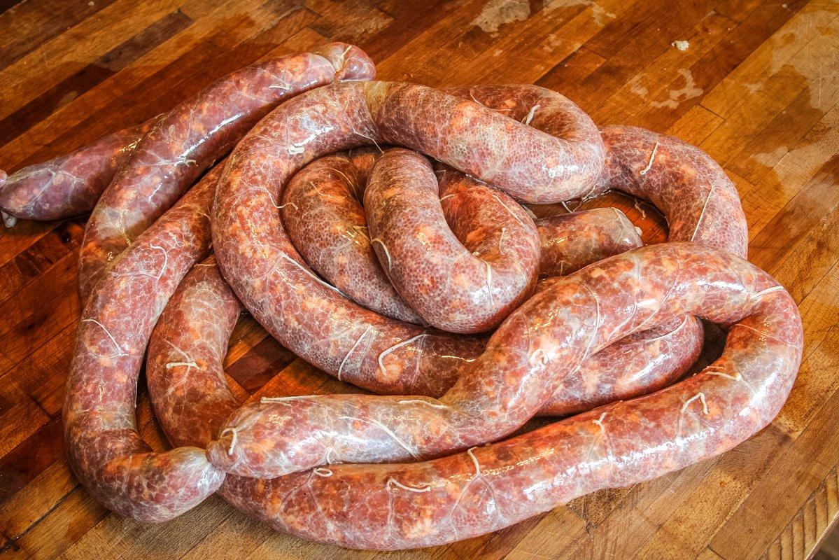 Grind up some game meat to make sausages for the grill.