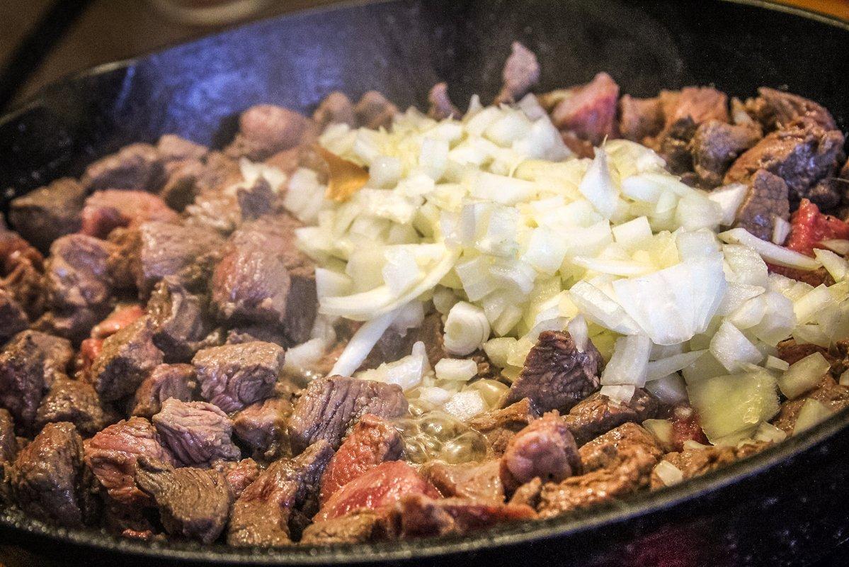 Brown the venison and diced onion together.