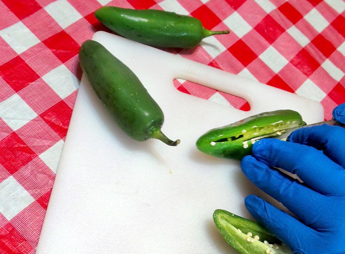It is a good idea to wear disposable gloves when working with hot peppers.