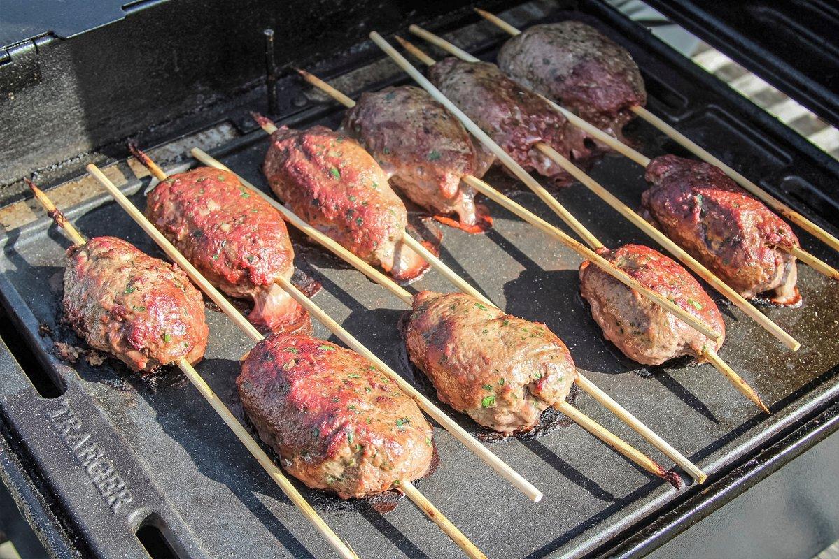 Insert soaked bamboo skewers into the meat balls and grill until the kofta is cooked through.