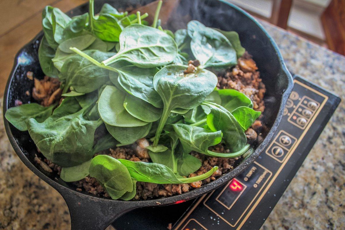 Add the spinach to the pan and fold in.