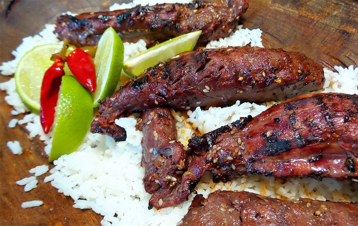 Serve the marinated and grilled venison over rice. Squeeze a lime over the dish just before eating.