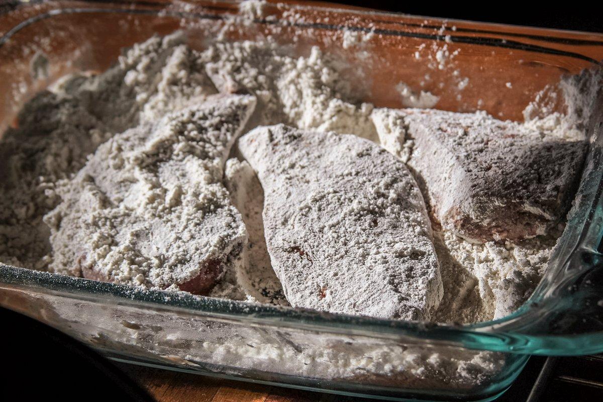Dredge the sliced liver in seasoned flour.