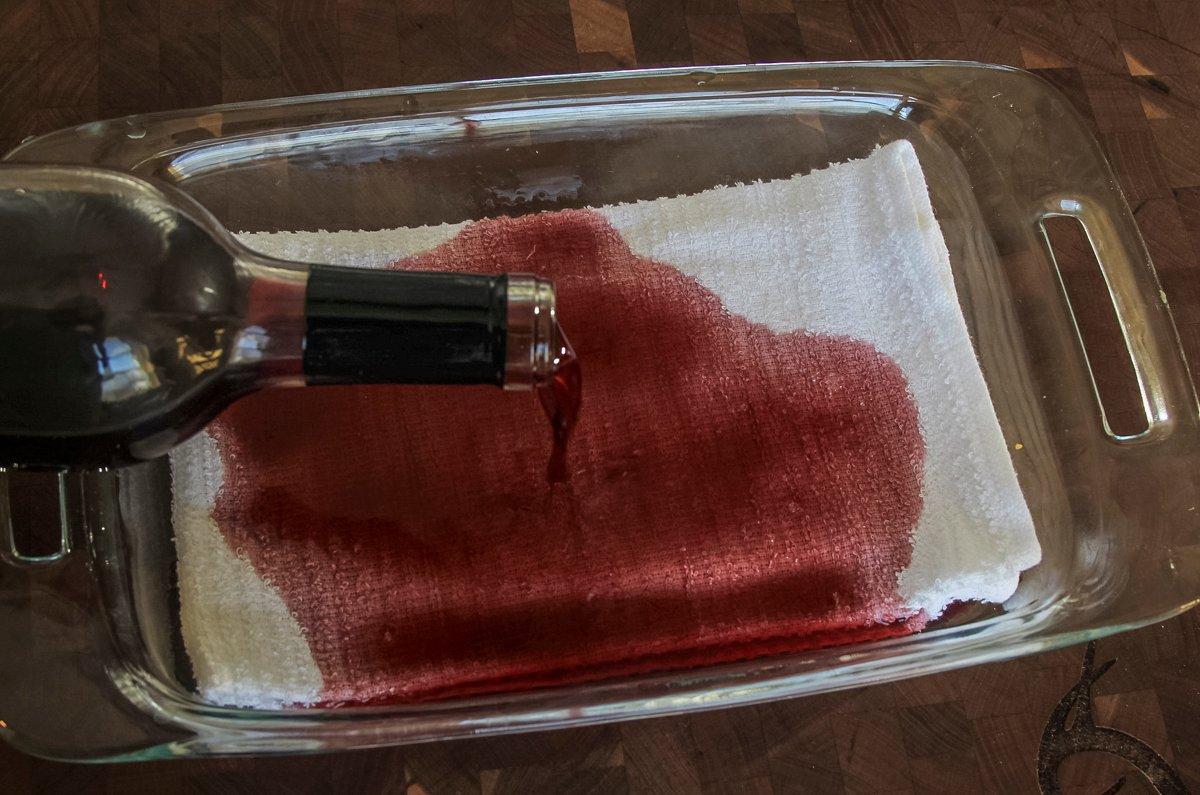 Start by soaking a clean cotton cloth with red wine.