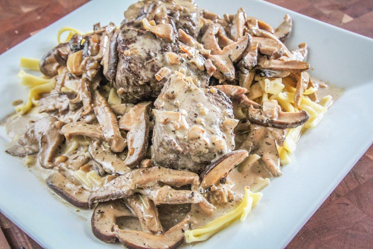 Serve the steaks over egg noodles and spoon more sauce over the dish before serving.