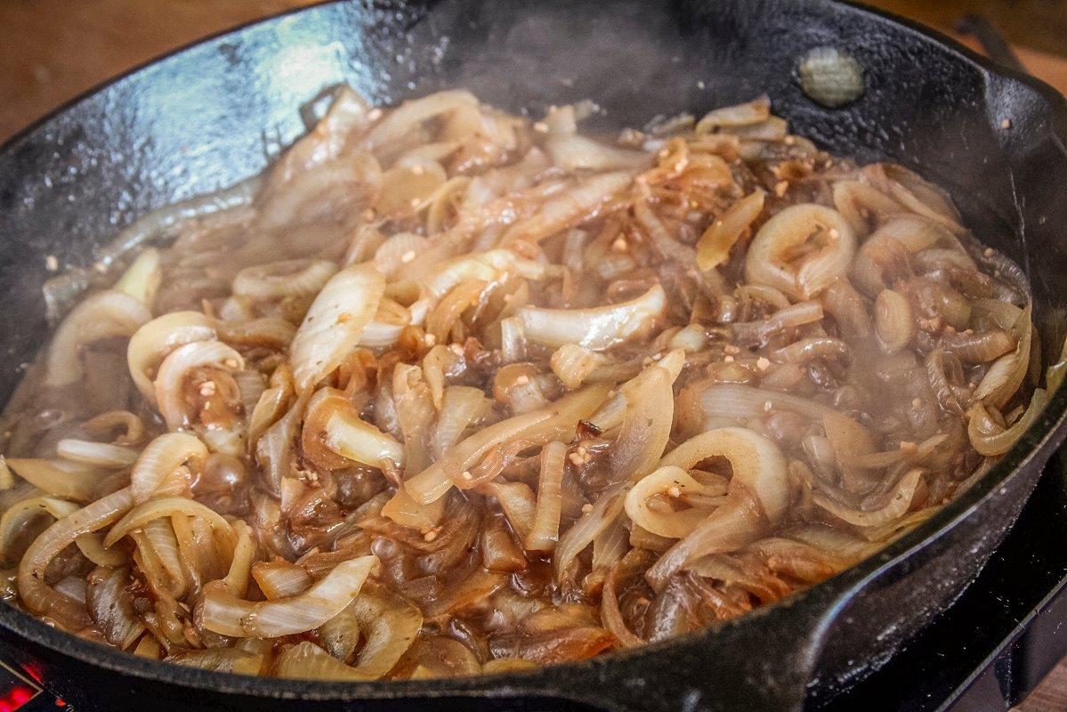 Start by caramelizing sweet onions with red wine, garlic, herbs and beef or venison stock. 