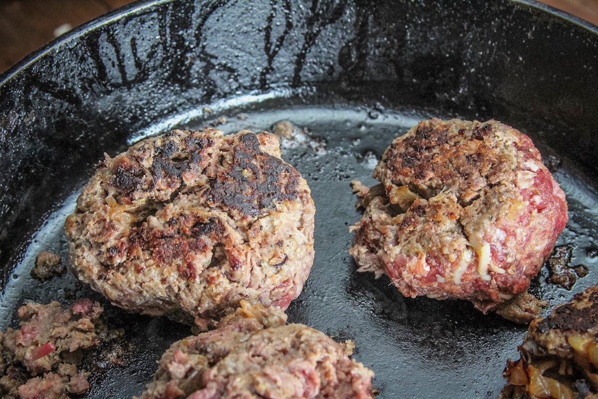 Gently brown the meatballs in a large skillet.