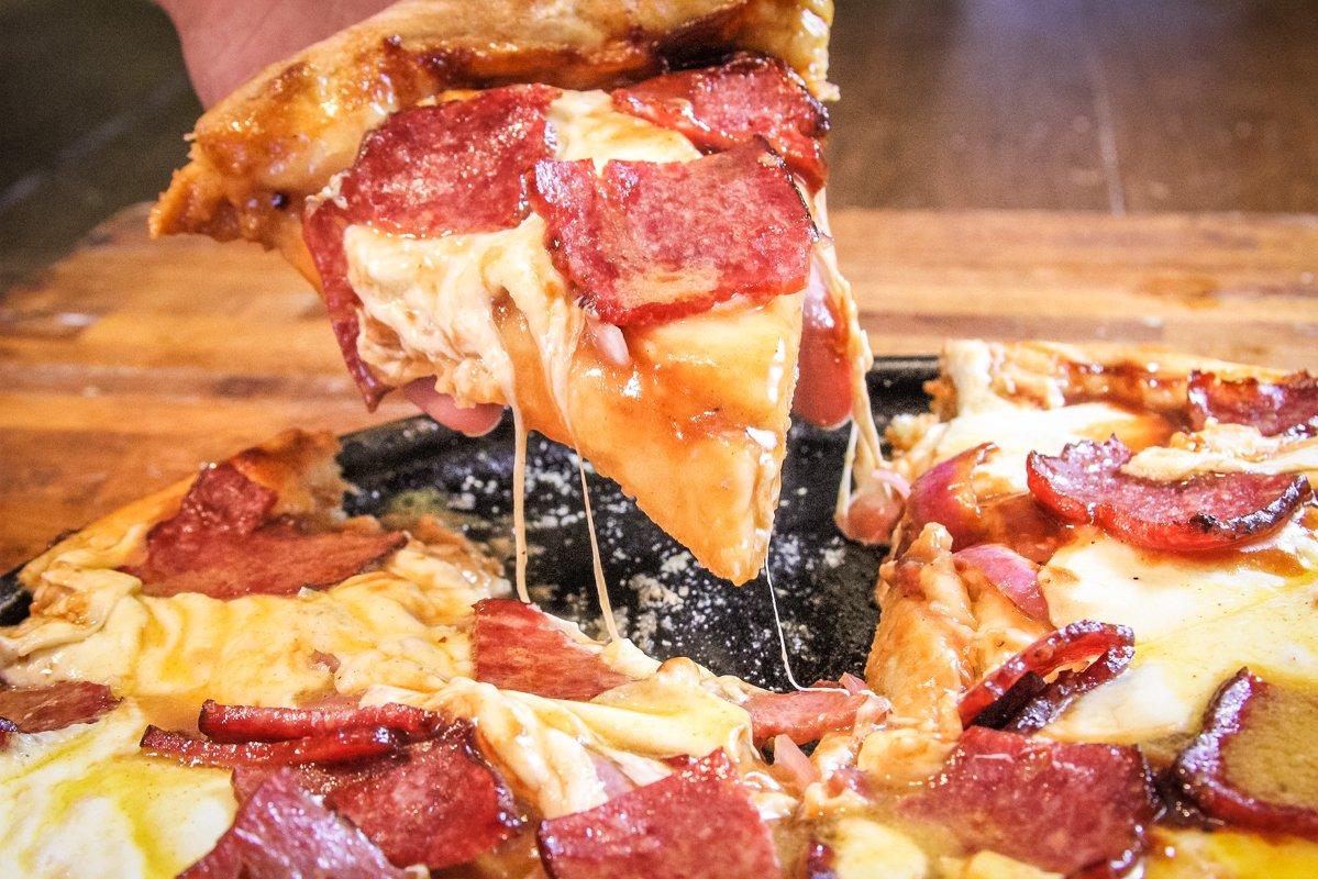 Sweet BBQ sauce, grilled red onions, and venison bacon make for a great pizza.