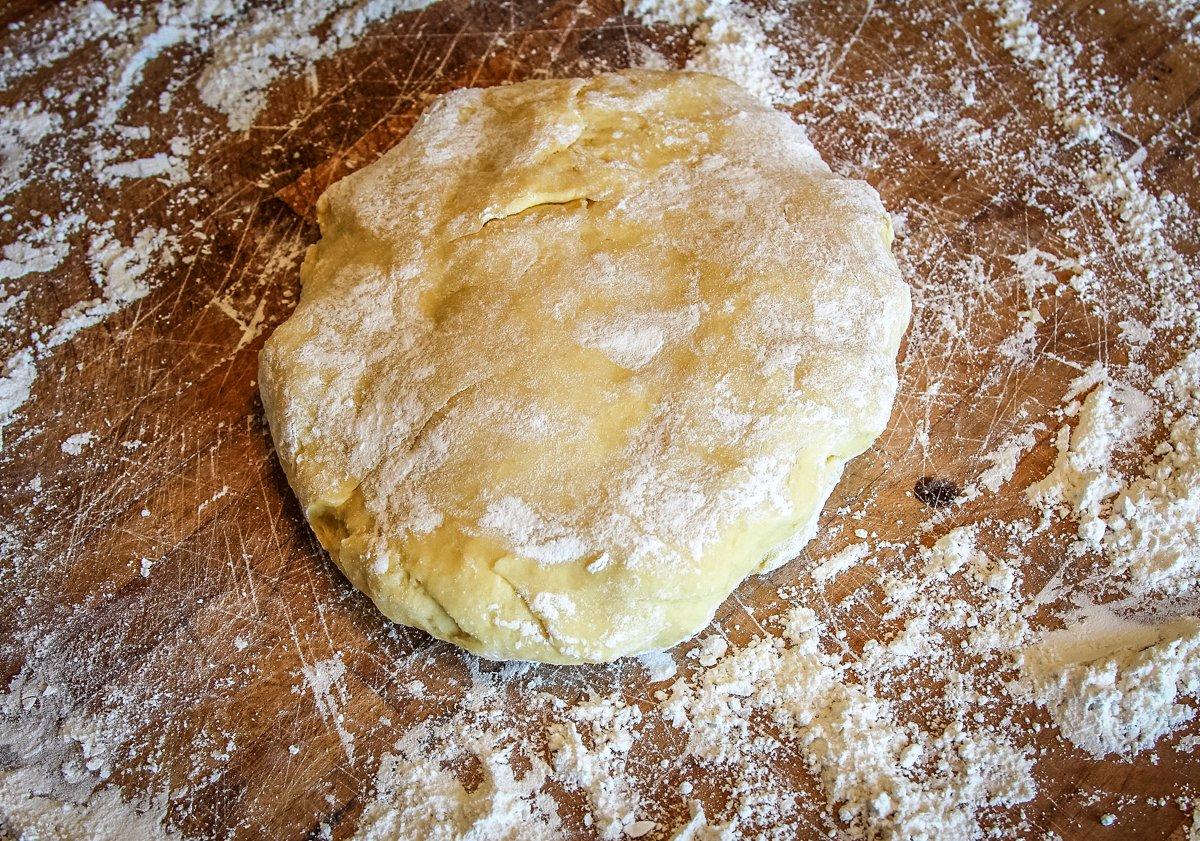 Roll the rested dough on a floured surface.