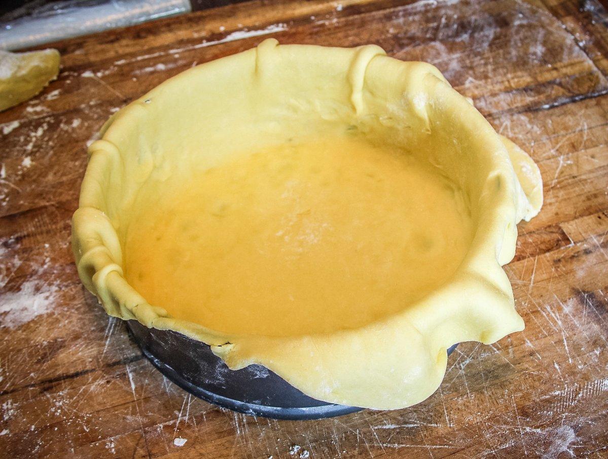 Form the rolled dough to the springform pan and trim off the excess from the top.