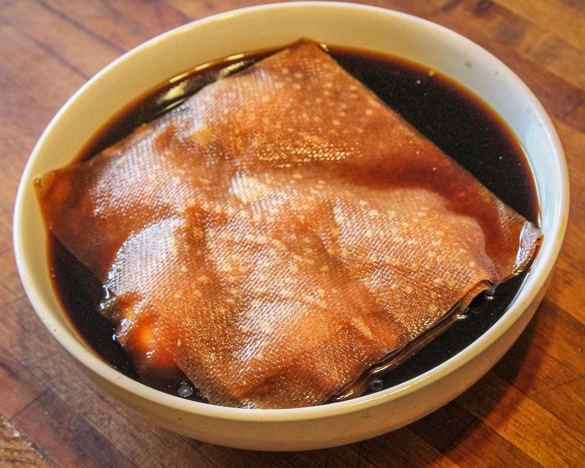 Peel the eggs and place in a bowl of marinade, covering with a folded paper towel to keep all sides exposed to marinade. 