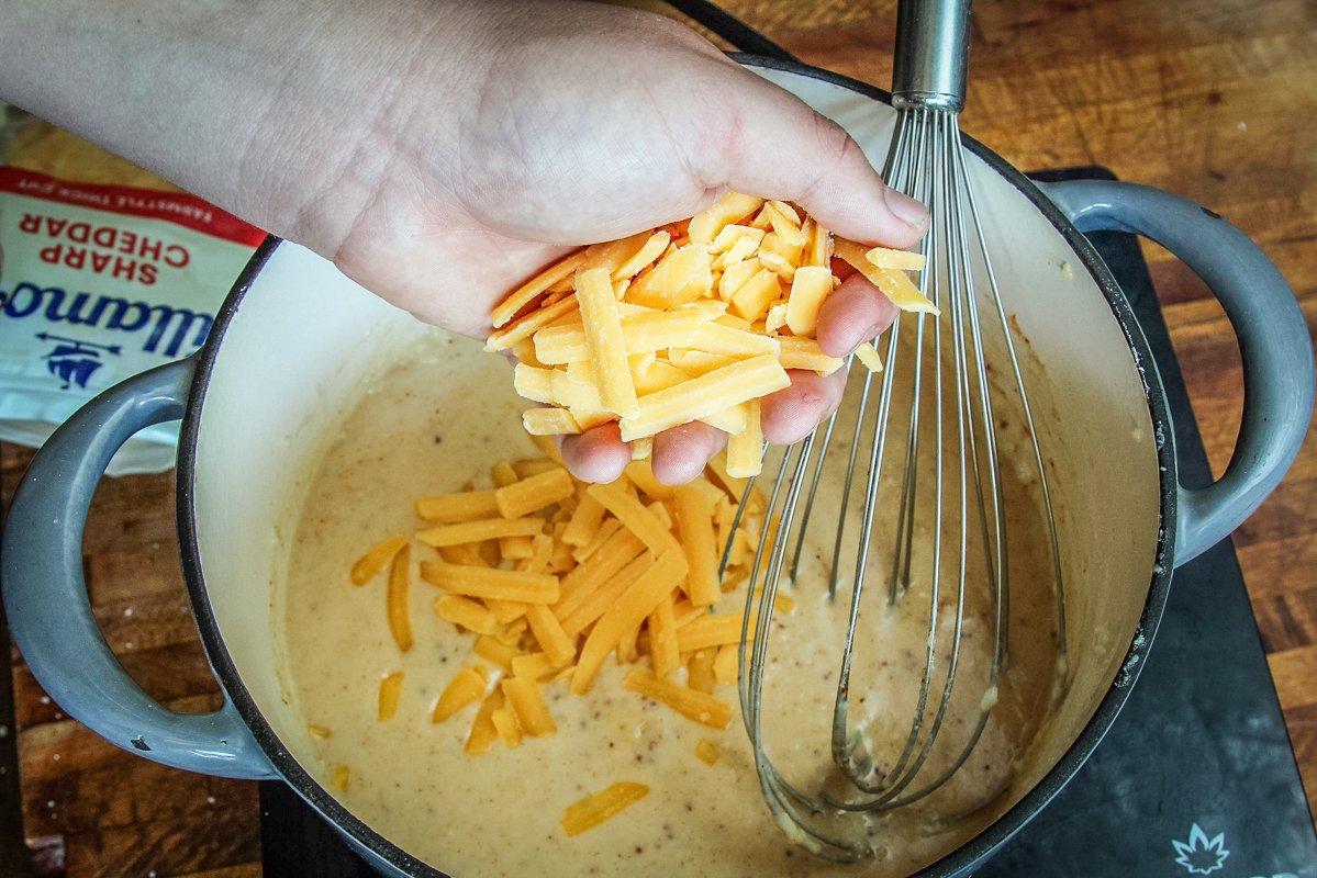 Add the cheese a handful at a time, stirring to melt as you go.