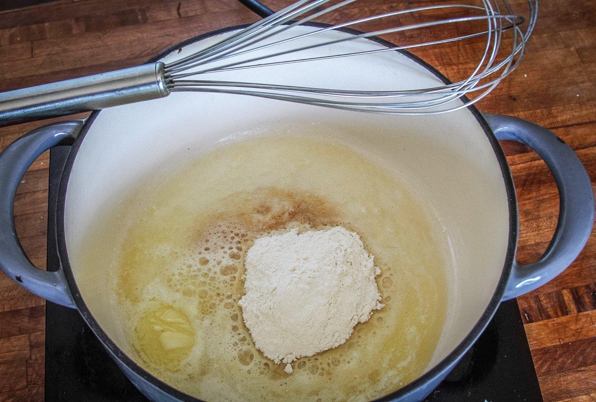 Start the beer cheese sauce with a flour and butter roux. 