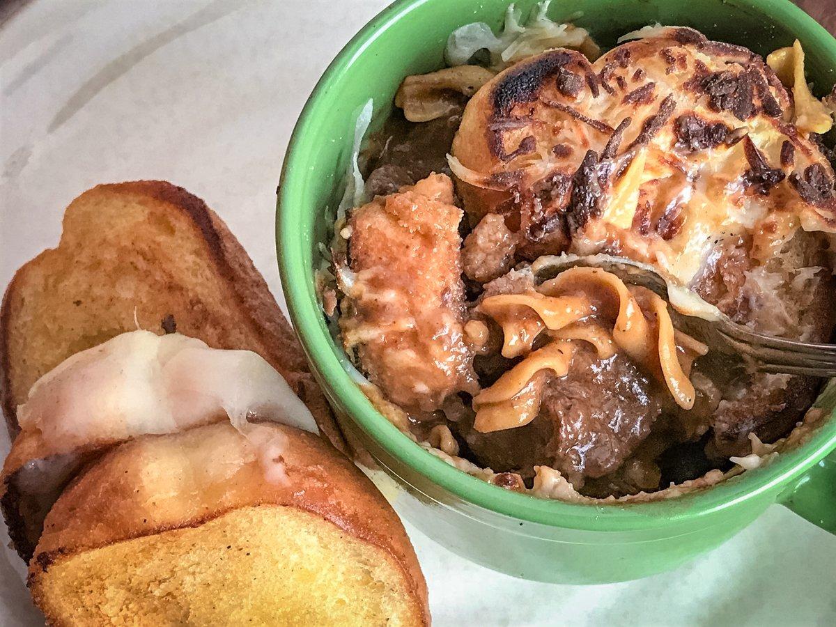 Slide the soup bowls under the broiler to melt the cheese. Serve with garlic bread grilled cheese sandwiches.