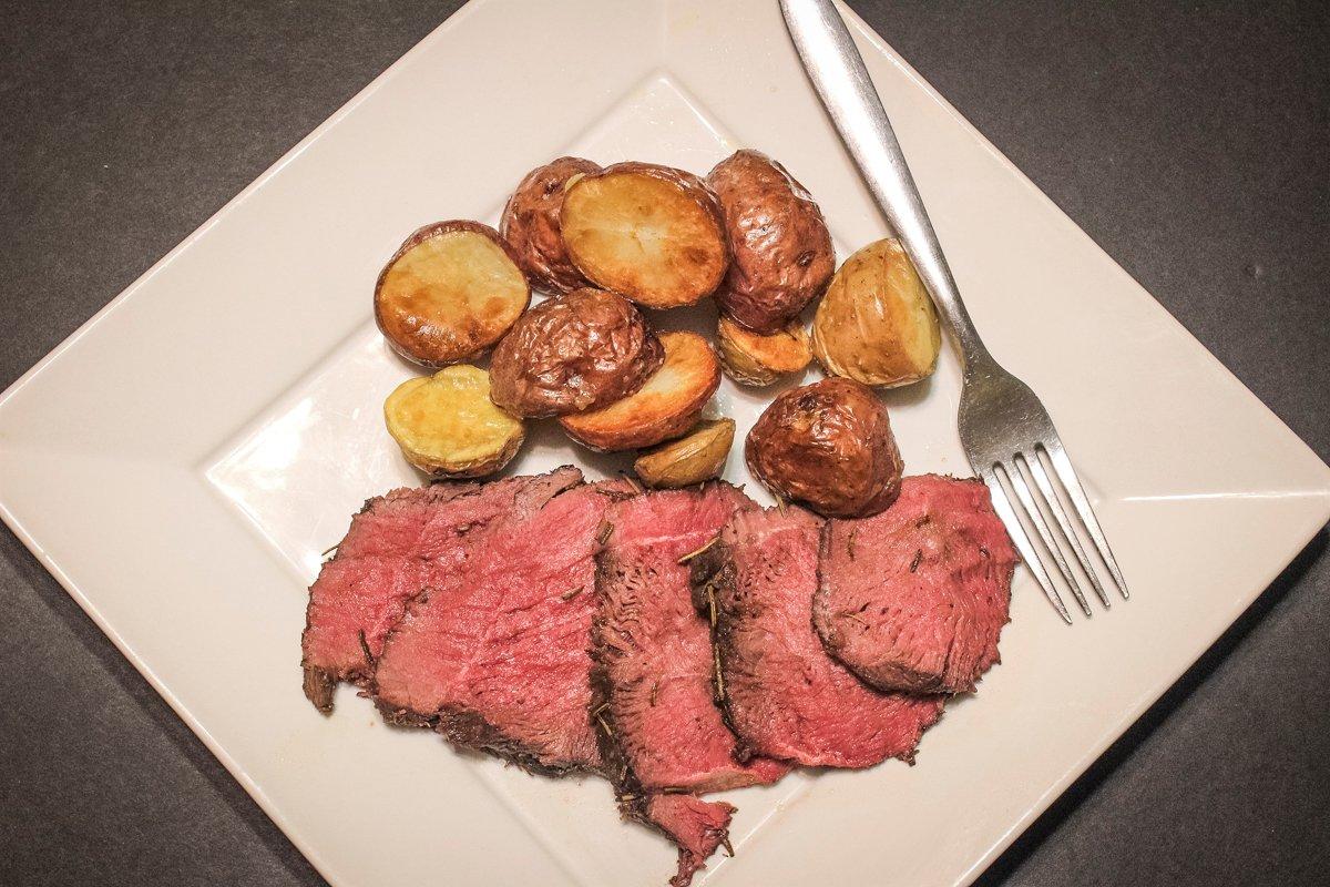 Even after a full twenty-four hours of cooking, the venison is medium-rare and tender.