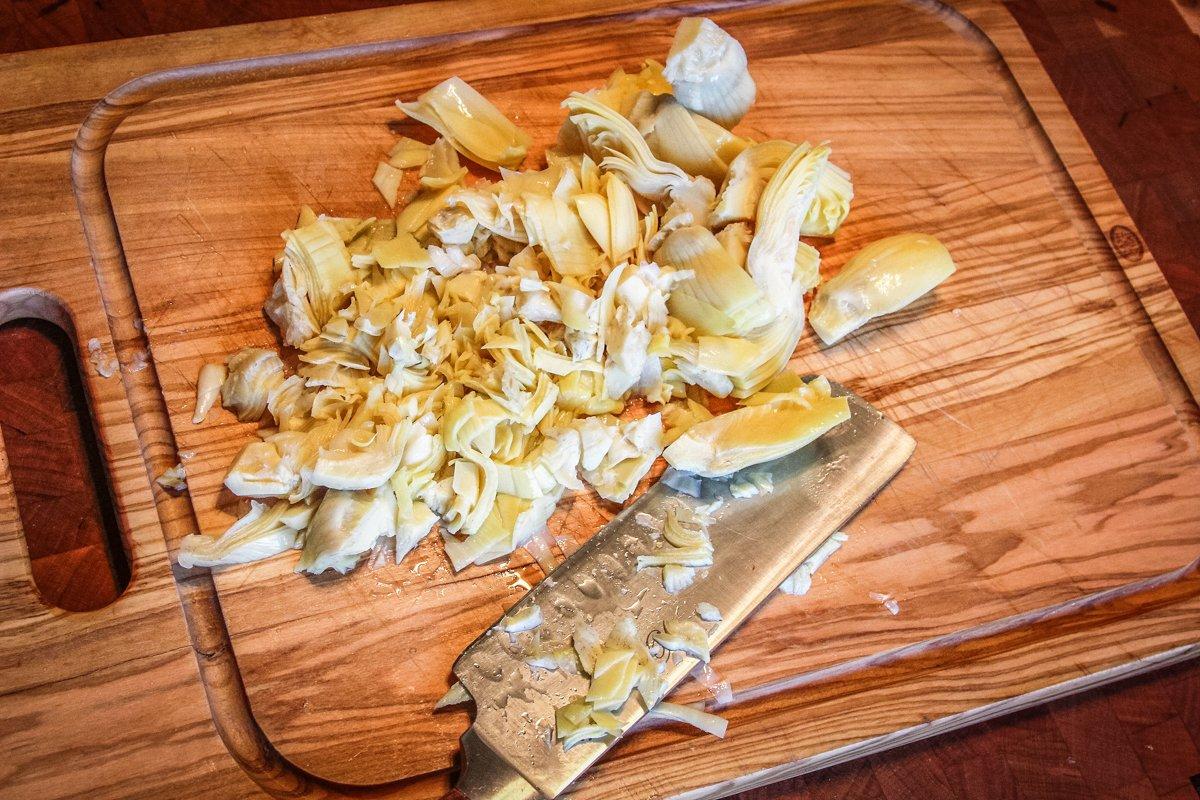 Give the artichoke hearts a rough chop before adding them to the dip.