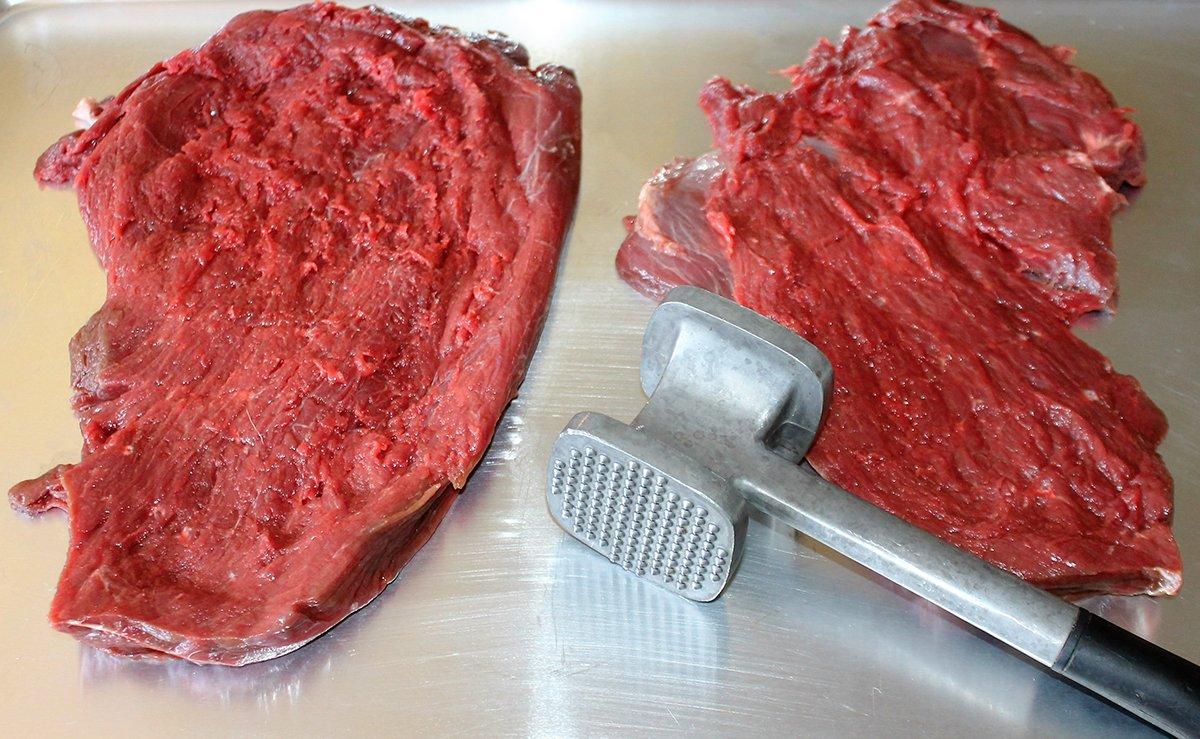 Pound the venison out flat with a meat mallet. Make sure the steaks are an even thickness.