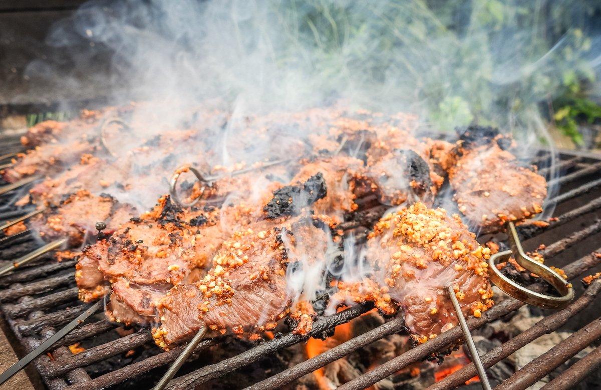 Traditional suya is grilled over hot coals.