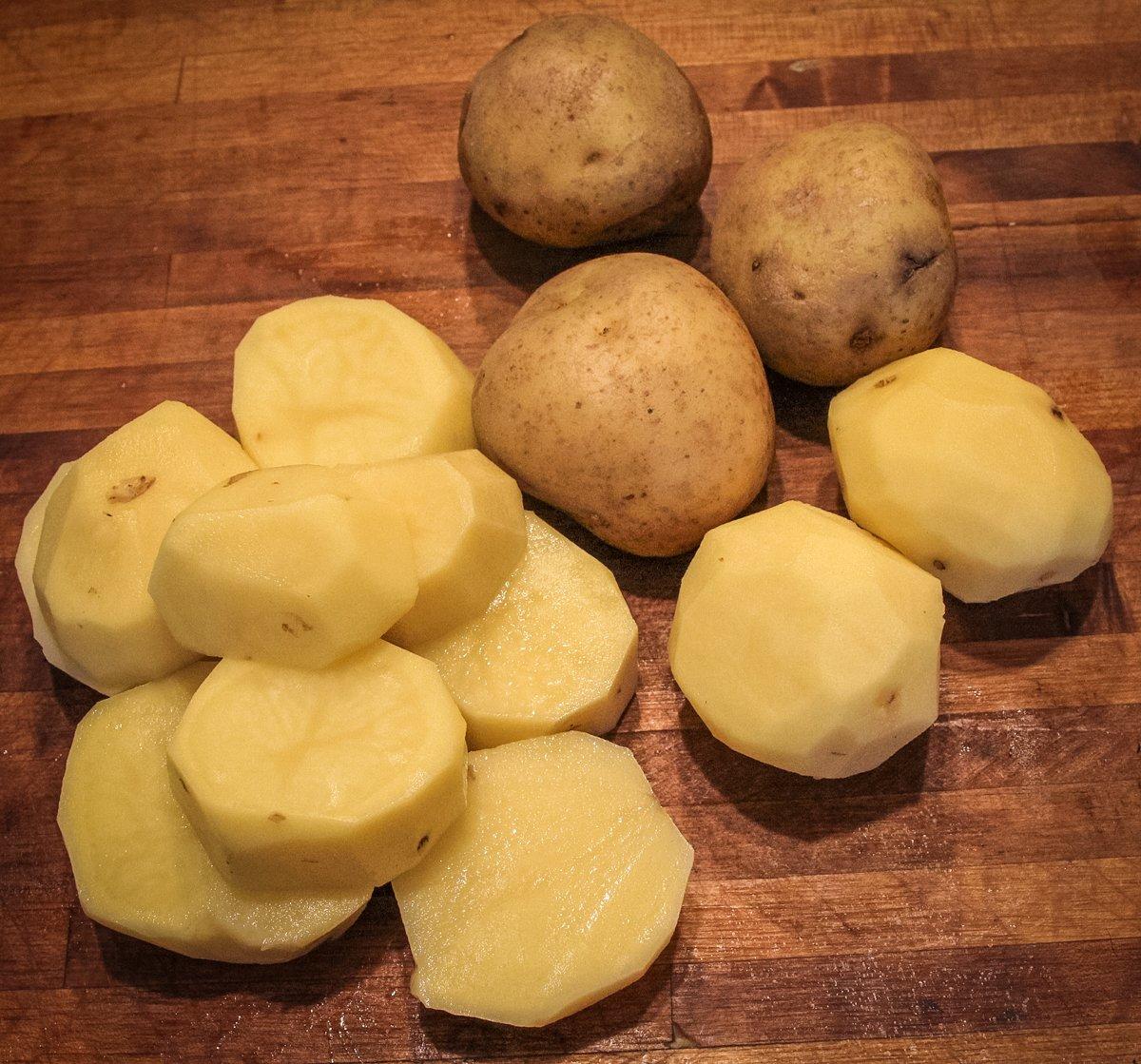 Peel the Yukon Gold potatoes then slice into thick rounds.