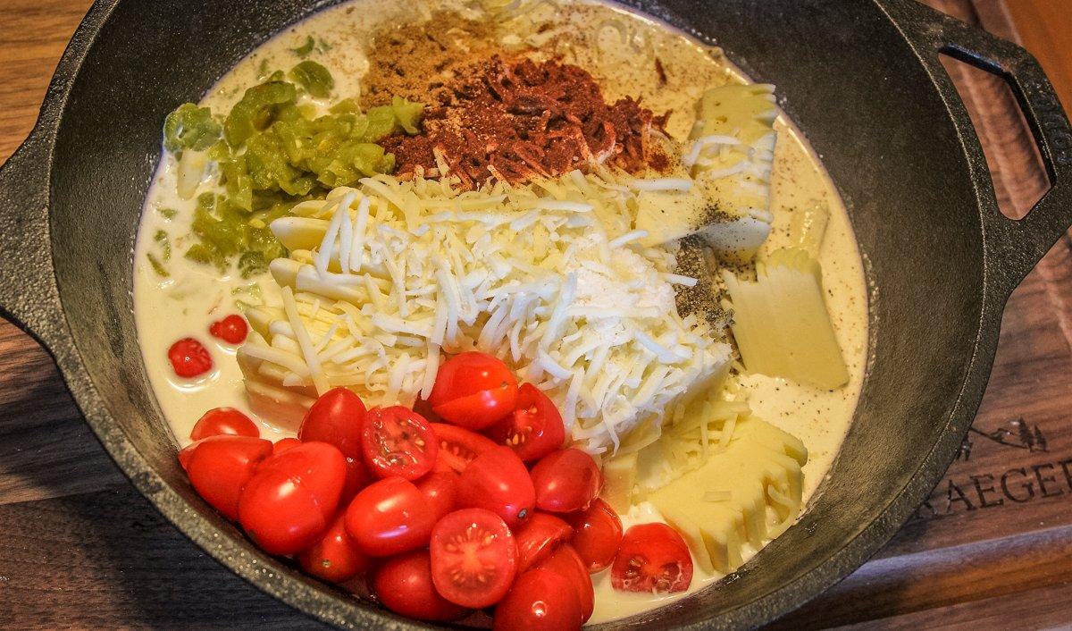 Mix all of the queso ingredients in a deep Lodge or other cast iron pan.