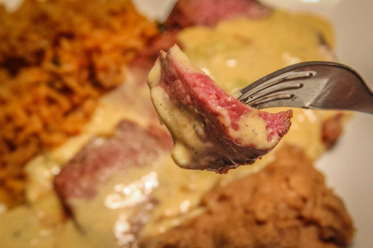 Spicy Tex-Mex rare grilled backstrap dipped in smoked queso sauce will satisfy your craving for spice.
