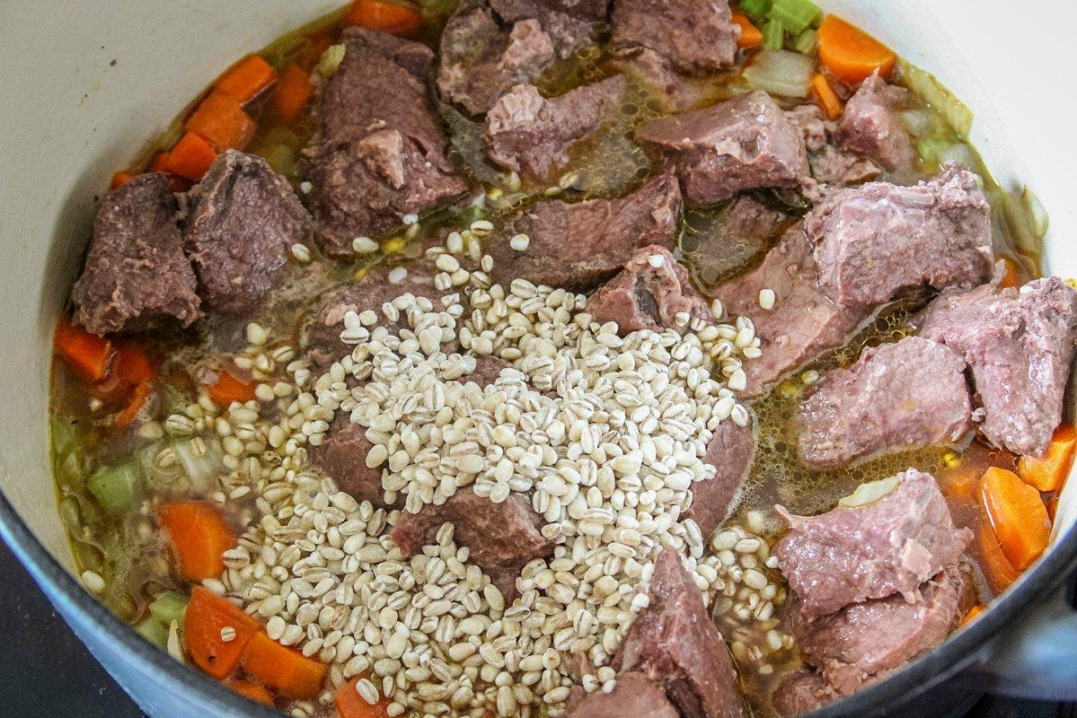 Add the canned venison and barley to the pot, along with the stock.