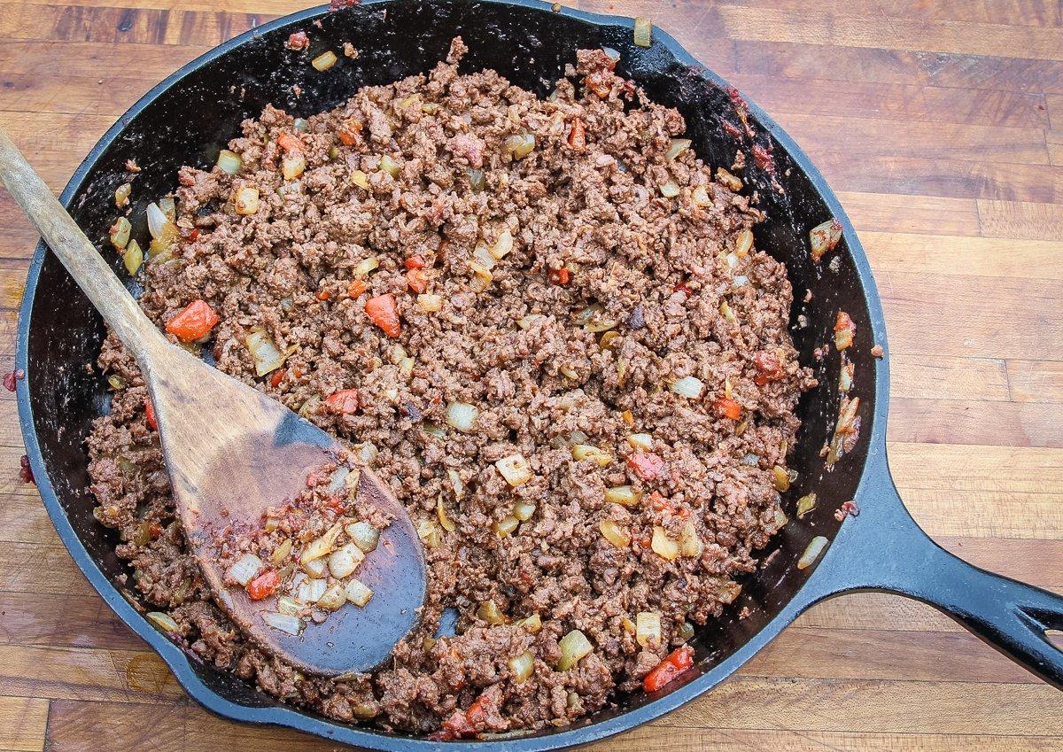 Add the ground venison to the skillet to brown.