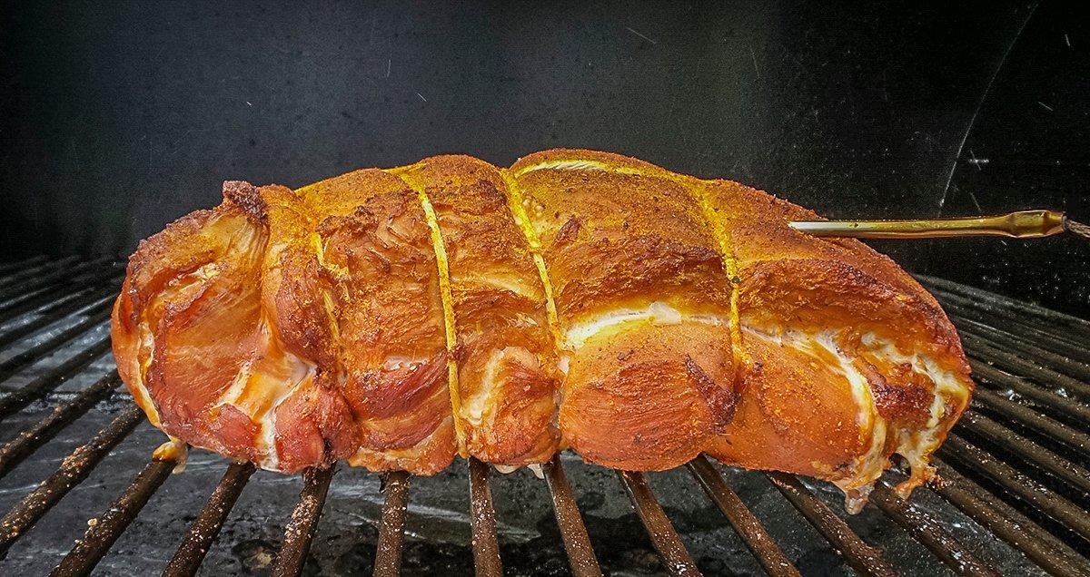 Rolled and tied turkey breast on the Traeger grill.