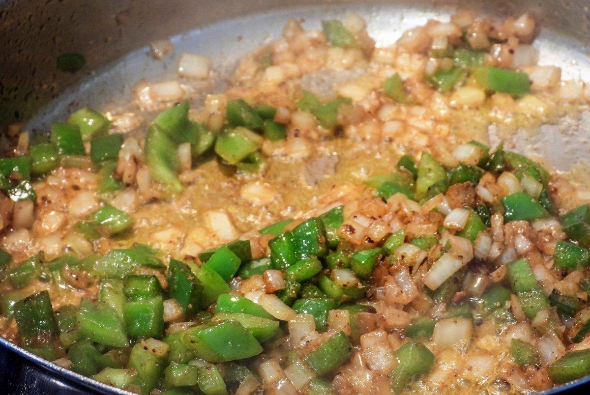 Cook the peppers and onions down until they are soft and caramelized. 