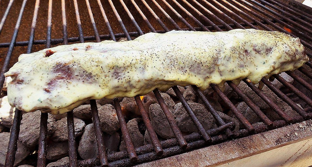 Coating the backstrap with the aioli adds moisture and flavor as the meat grills.
