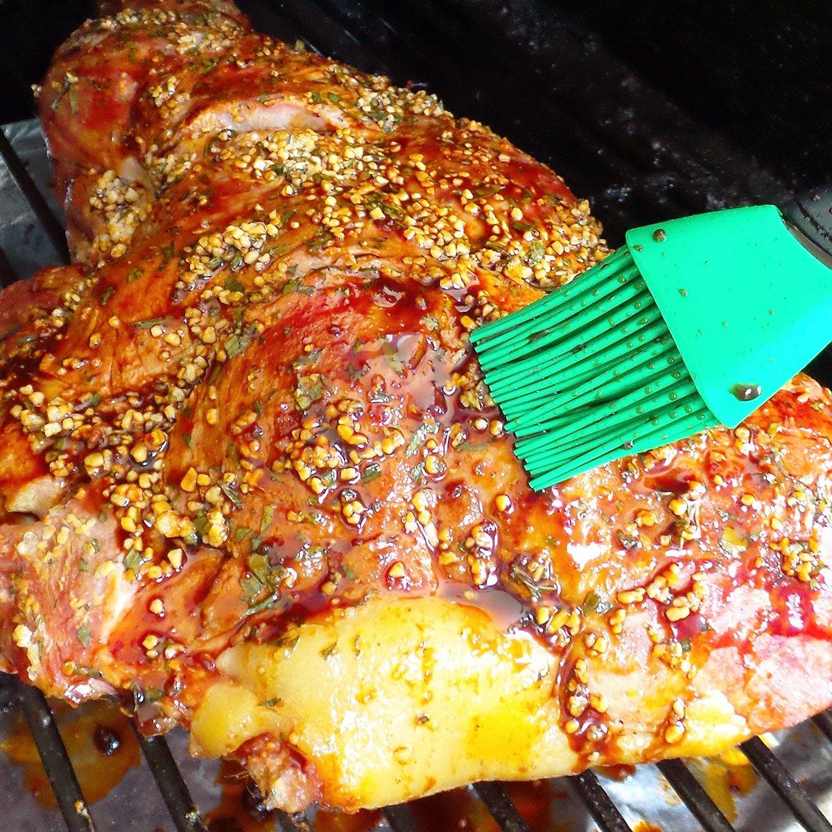 An overnight brine along with regular basting with the mop sauce keeps the ham juicy and flavorful.