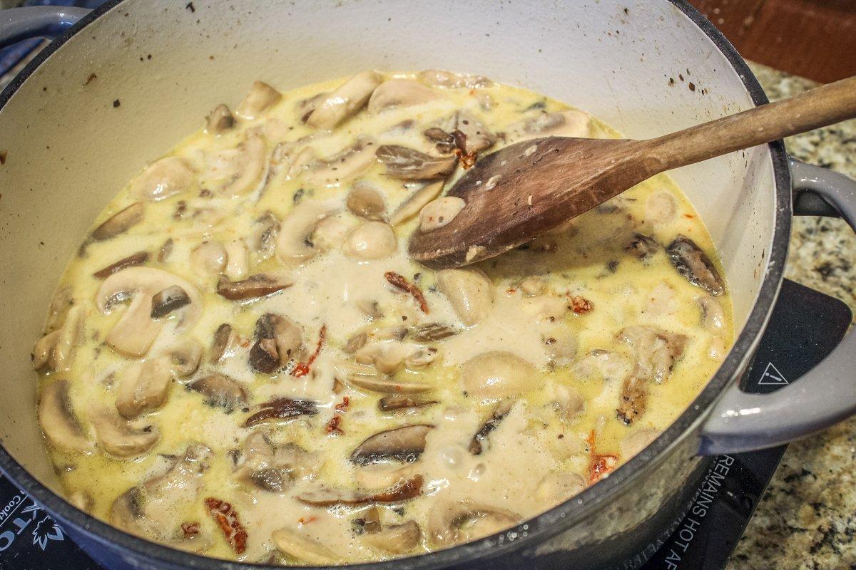 Build the creamy mushroom sauce in the pan, then return the turkey and bake.