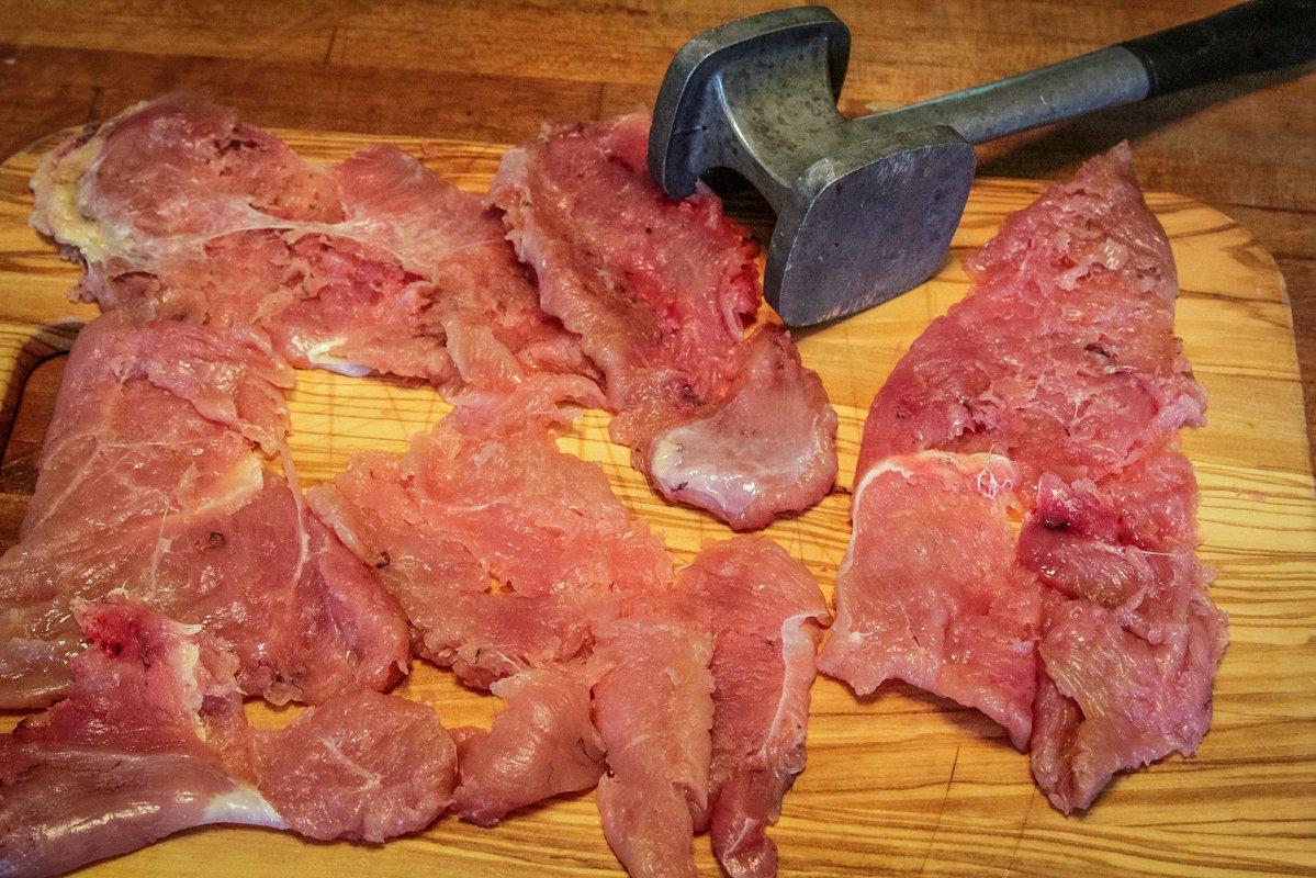 Pound the turkey breast cutlets flat with a meat mallet to tenderize.
