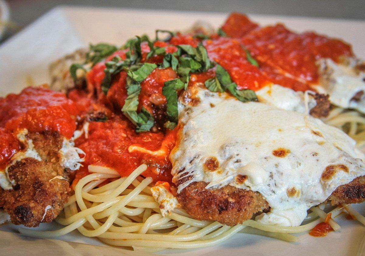 Top with sauce, fresh basil, and parmesan cheese before serving.