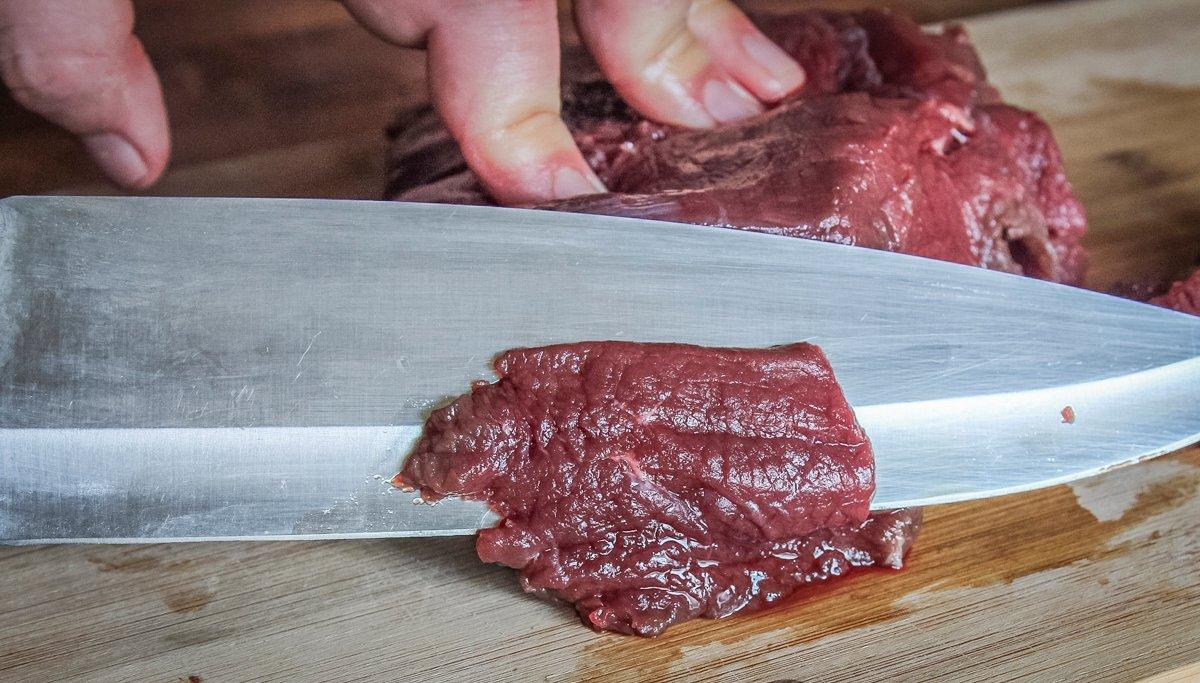 Slice the venison into thin, bite sized slices.