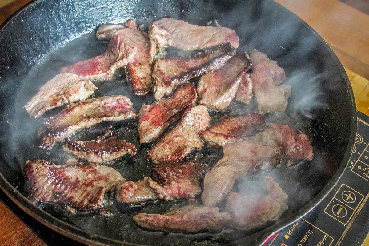 Sear the venison in a very hot iron skillet.