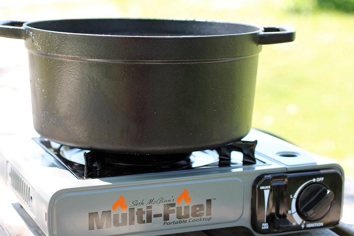 Seth McGinn's Mult Fuel Cooktop and a Dutch oven make the perfect pair for rendering outdoors.