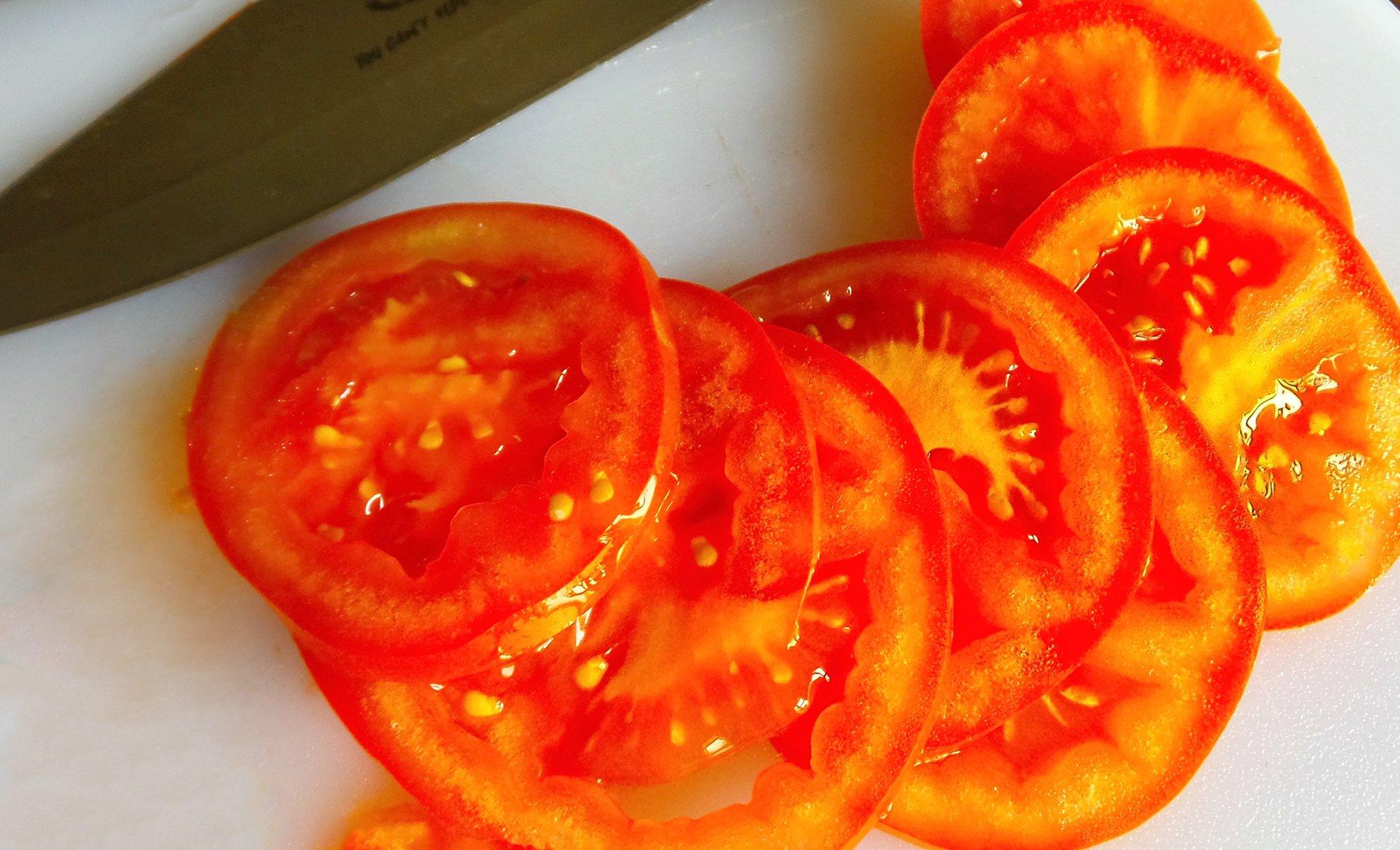 Summer is tomato season, slice a fresh, vine ripened tomato thinly and add it to your gyro.