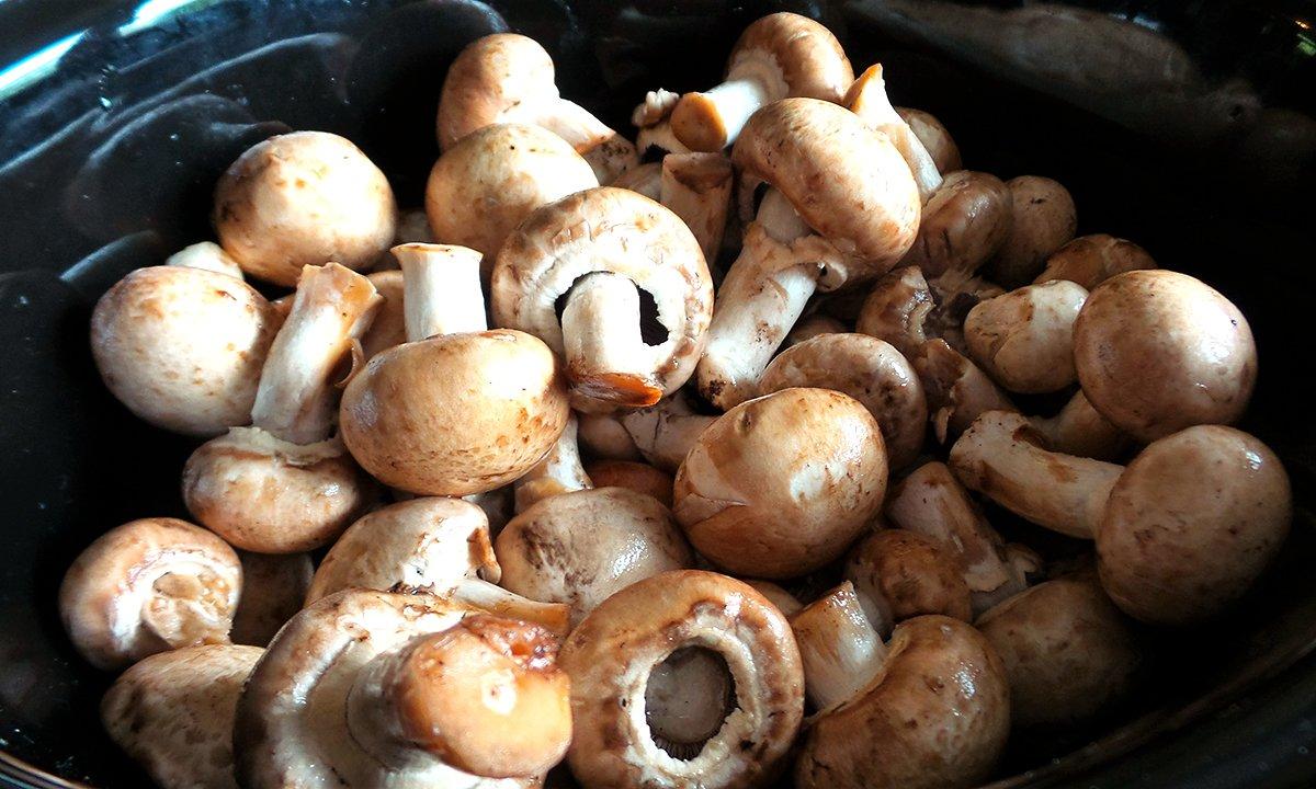 Layer the onions and mushrooms in the bottom of the slow cooker and pour in the sauce ingredients.