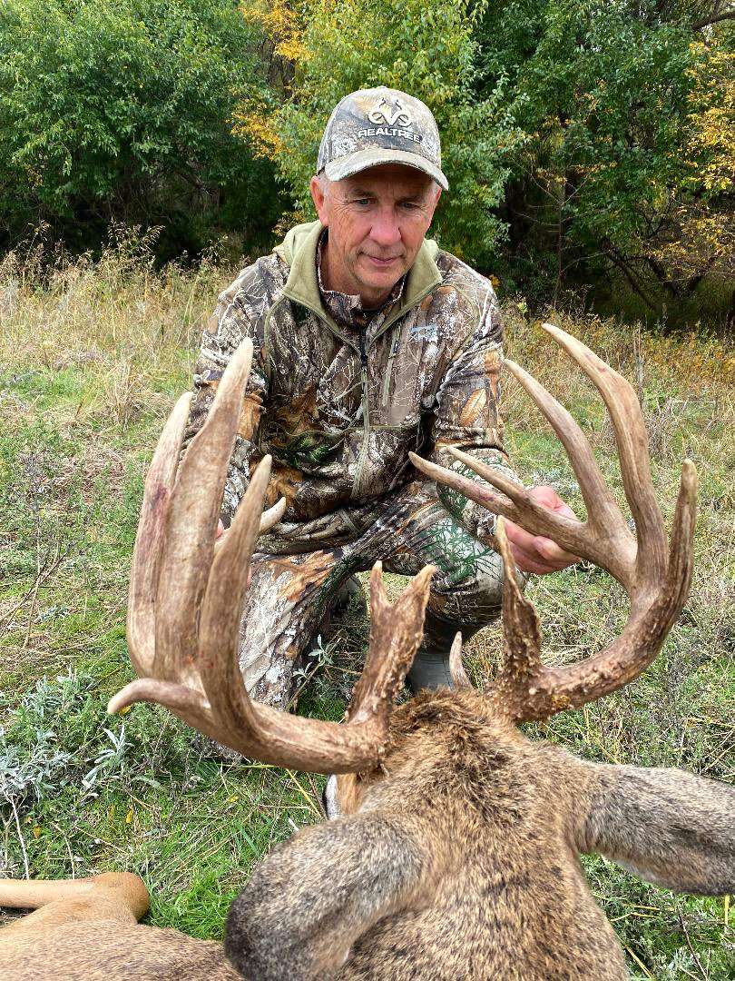 Blanton admires the incredible mass and tine length this buck exhibits. by Realtree Media