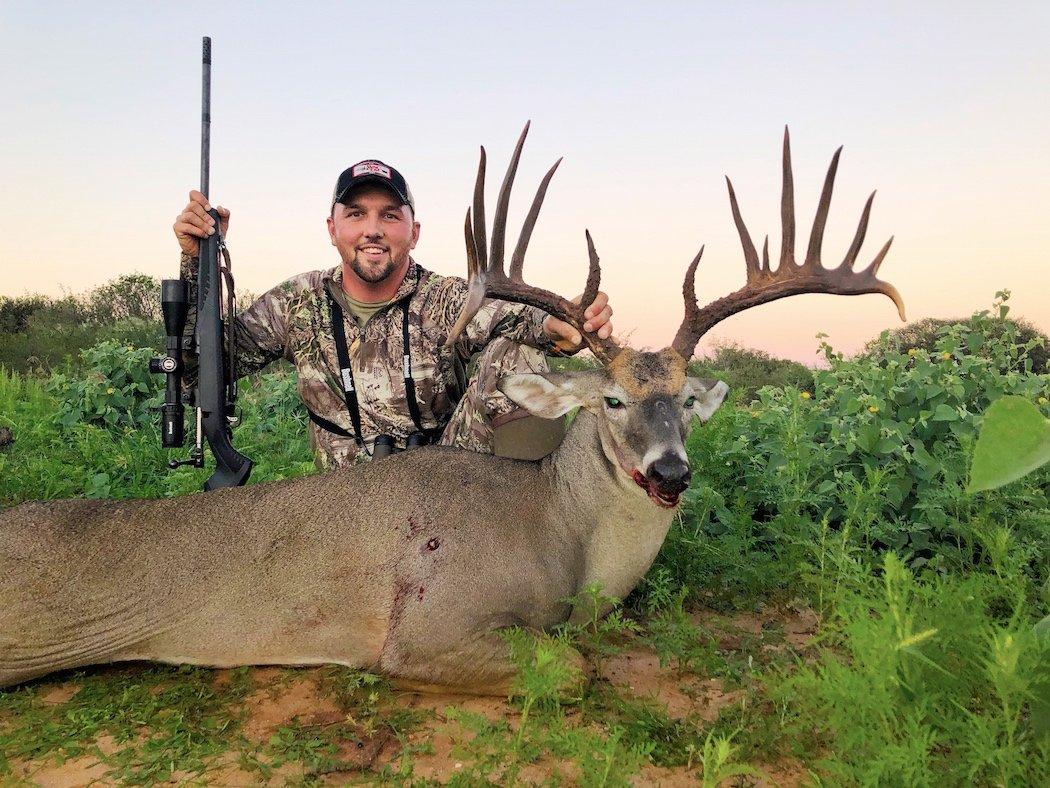 Savage Outdoors and The One co-host Mike Stroff poses behind a wide Texas buck. (Mike Stroff photo)