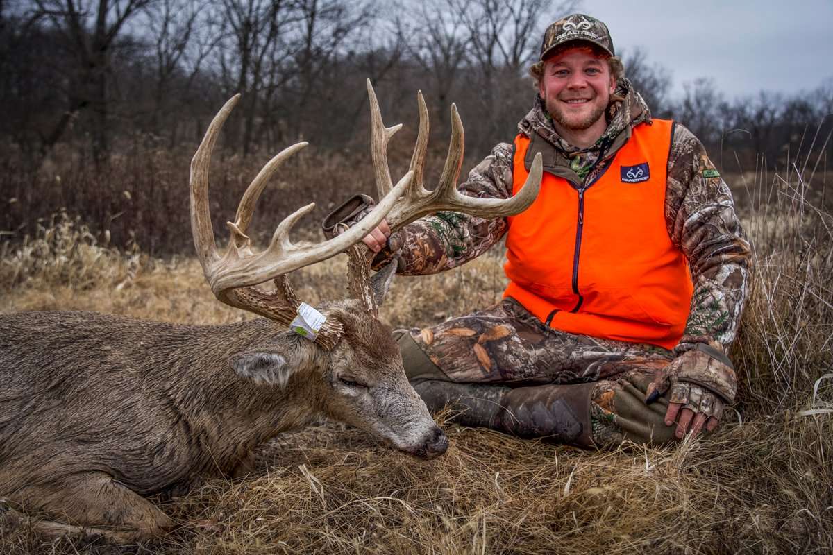 Midwest Whitetail's Drake Lamb poses with his 185-inch Iowa giant. (41 North photo)