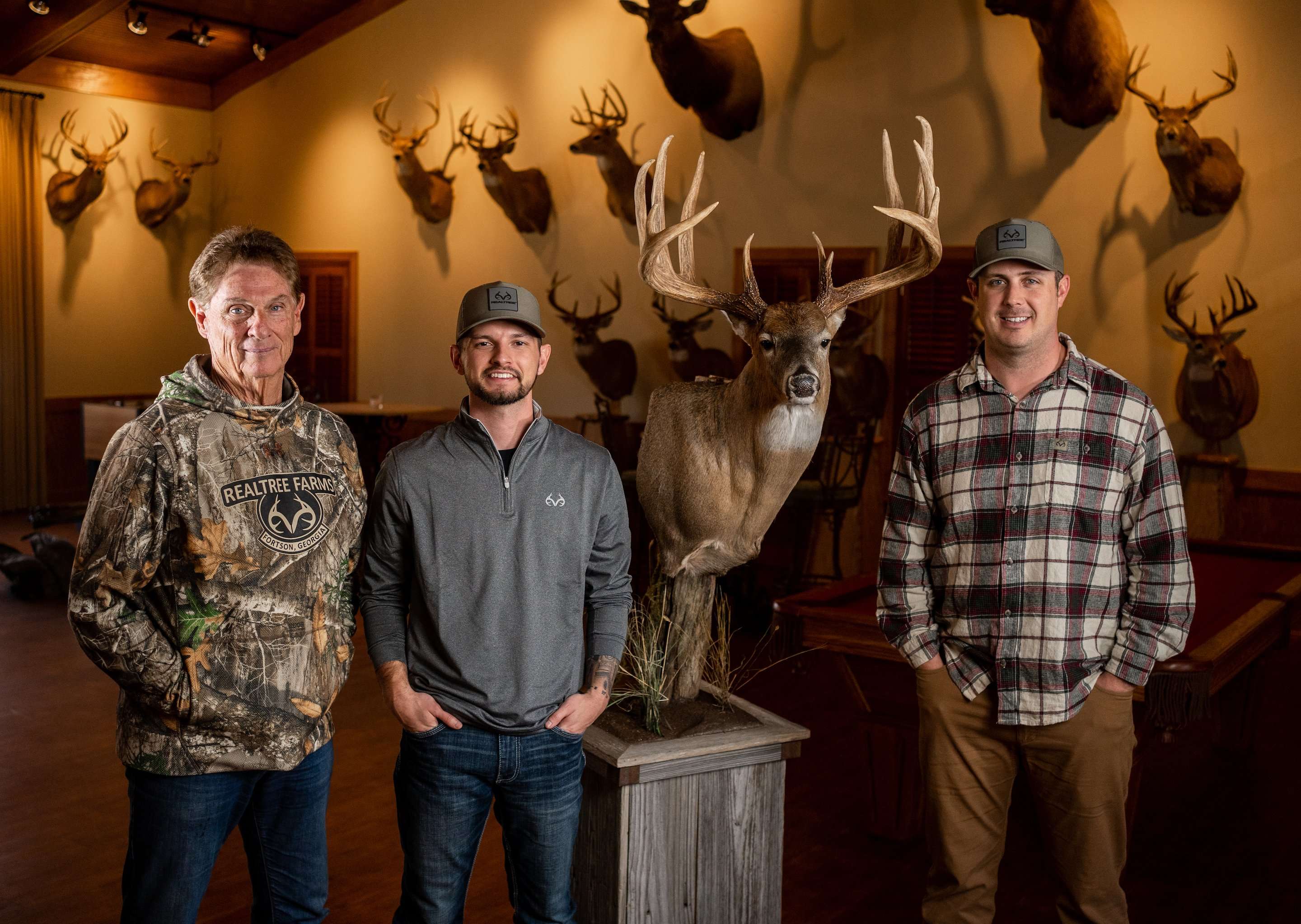 Dustin Huff talks deer hunting with Bill and Tyler Jordan. Image by Realtree Media